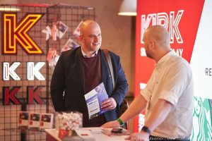 Visitor-at-Kirk-Signs-exhibition-stand